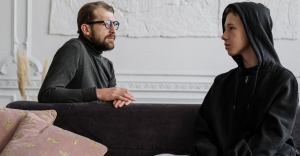 man and young man talking