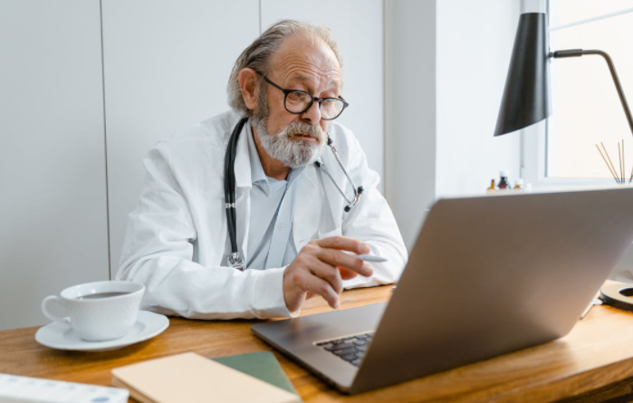 a doctor on a laptop